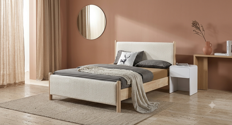 The CALLALA Bed with solid light rubber wood frame and soft off-white chenille upholstery in a modern bedroom setting.