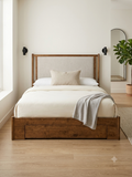 Arbor Bed Frame with warm solid wood structure and light grey upholstered fabric headboard, featuring under-bed storage drawers.