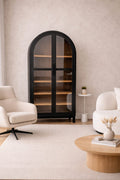 Arch Cabinet in black finish with tempered glass doors and soft-closing hinges, featuring five spacious shelves for elegant storage and display.