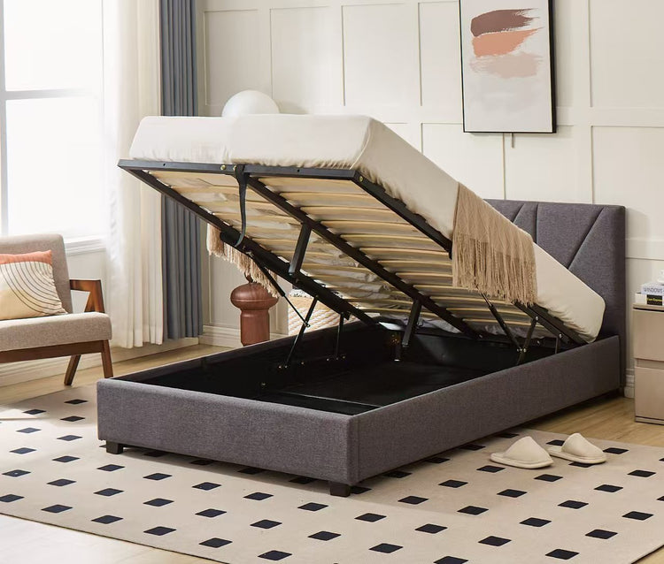 Hudson hydraulic storage bed with grey upholstered frame, cream mattress and lift-up slatted base revealing storage space.