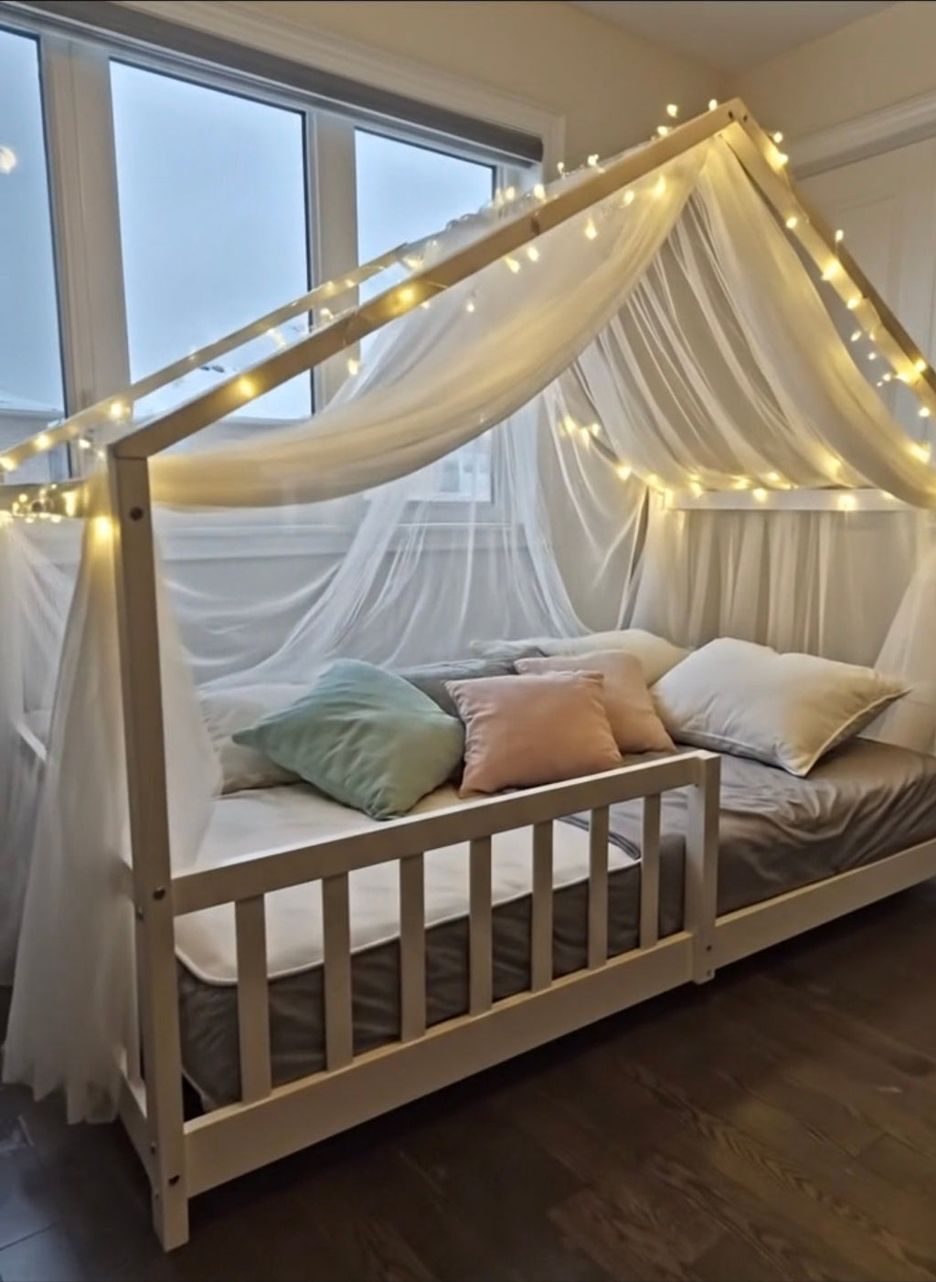 White Double Luna House Montessori floor bed with solid pine wood frame and peaked roof design