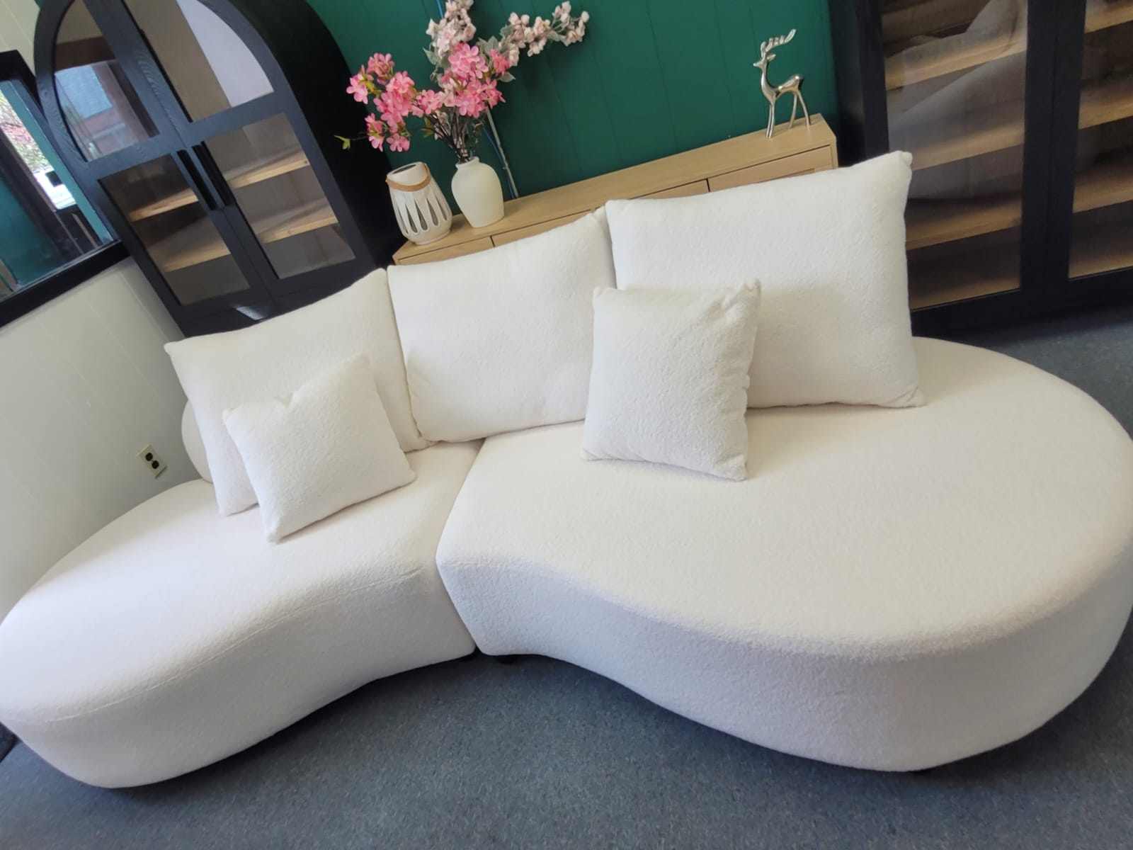 Monaca Crescent Curve Sofa in soft teddy fleece upholstery with plush cushions and contemporary curved design