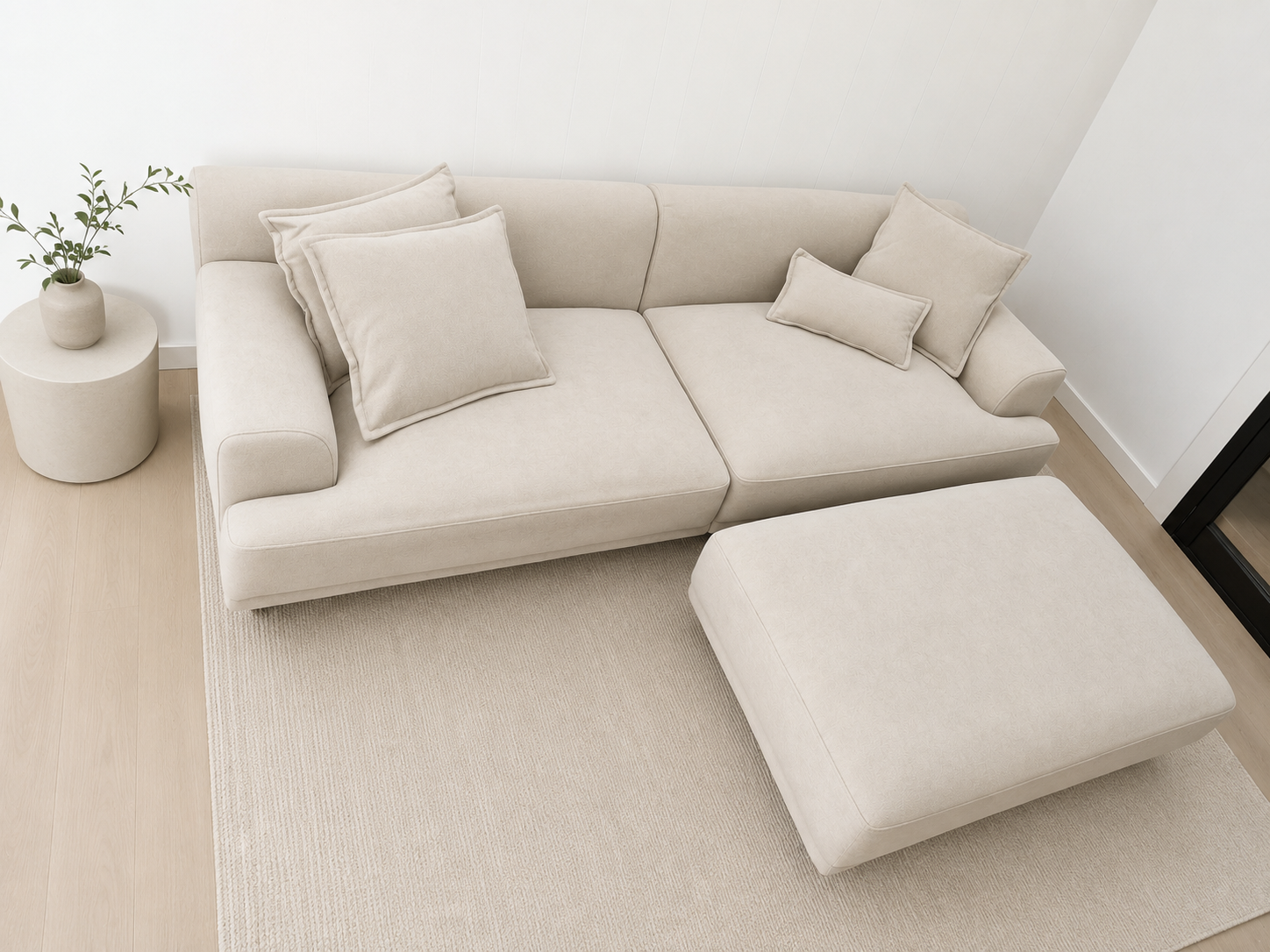 The Sage Haven Sofa in beige chenille with matching ottoman and sleek black legs in modern living room