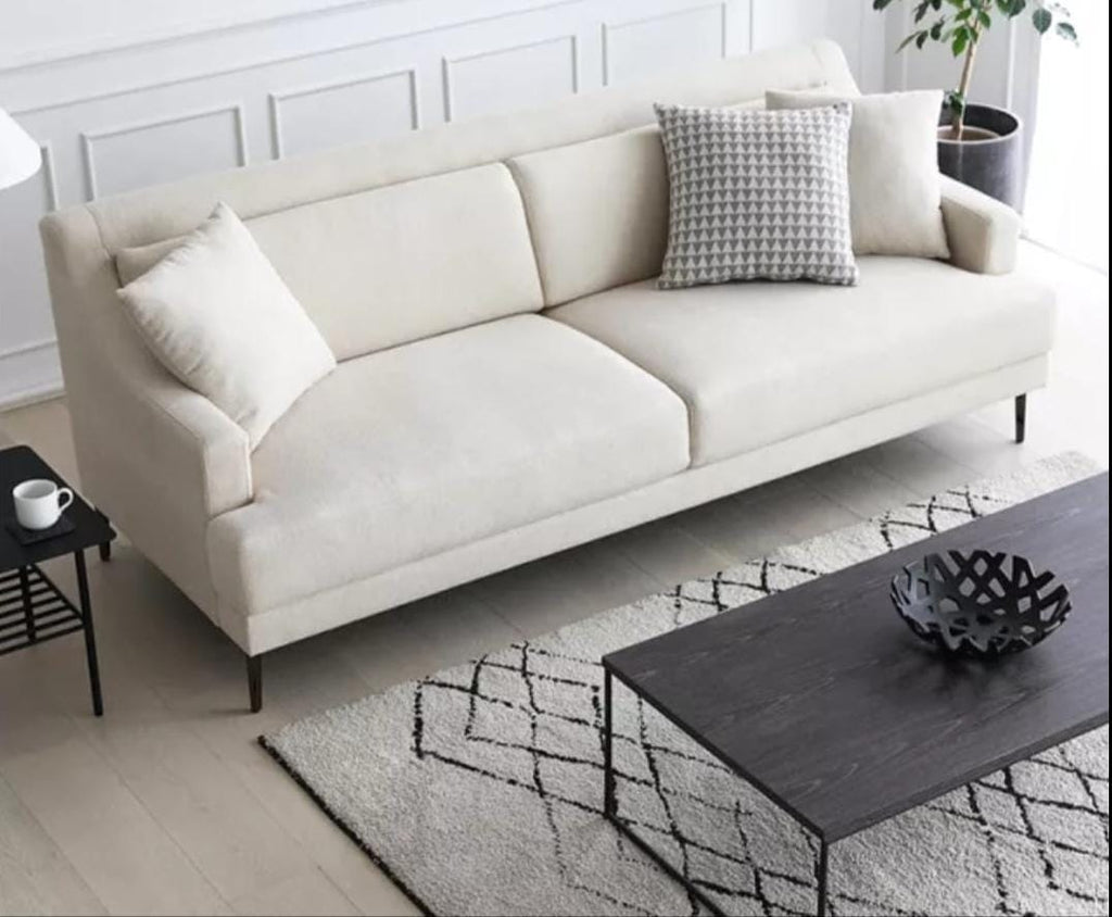 Contemporary style loveseat in beige with wooden legs and plush cushions in modern living room setting
